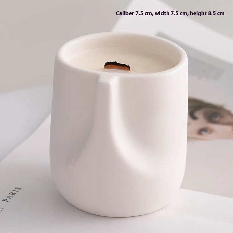 Set of ten round white ceramic candlesticks with minimalist relief patterns on a dining table