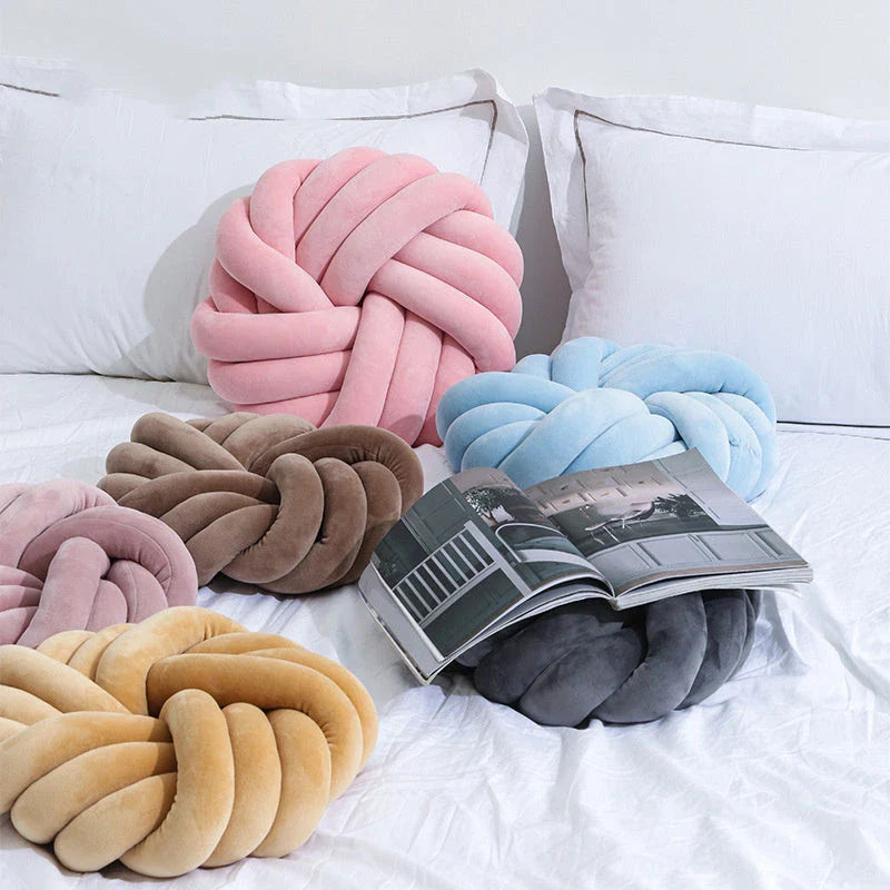 Plush decorative throw pillows with knotted ball design in various colors for living room, bedroom, and photography