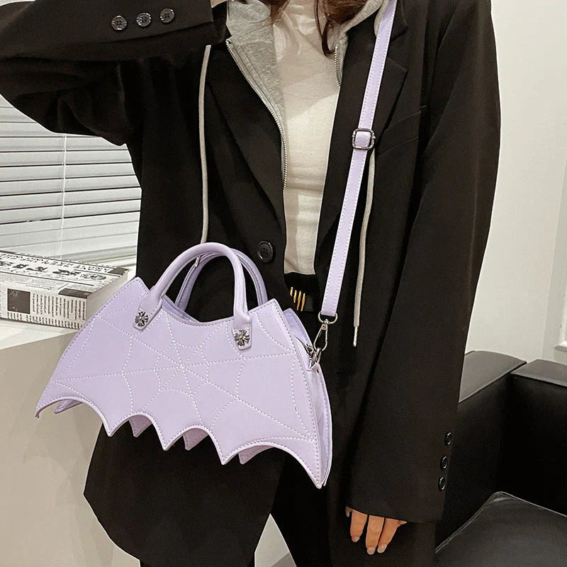 A stylish Halloween shoulder bag with a captivating spider web design, made of durable PU leather and offering ample storage space.