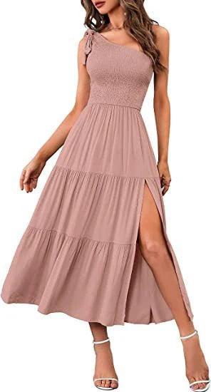 Elegant one-shoulder pleated maxi dress in various colours, featuring an asymmetrical hem and side slits for a stylish, head-turning look