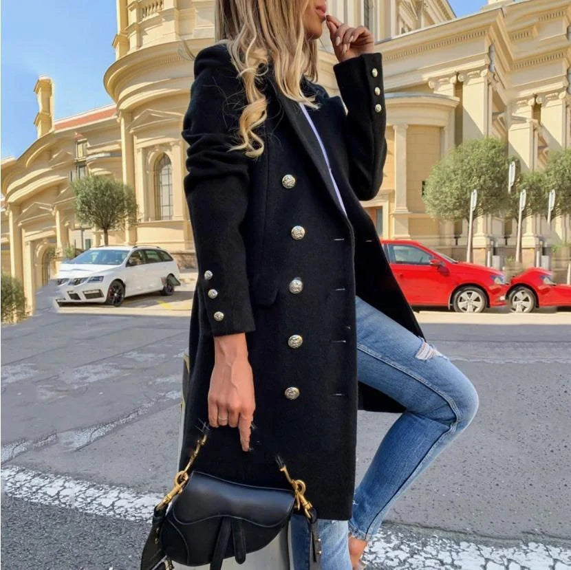 A classic woolly lapel coat with a double-breasted design, featuring a mid-length silhouette and available in black and yellow colours.