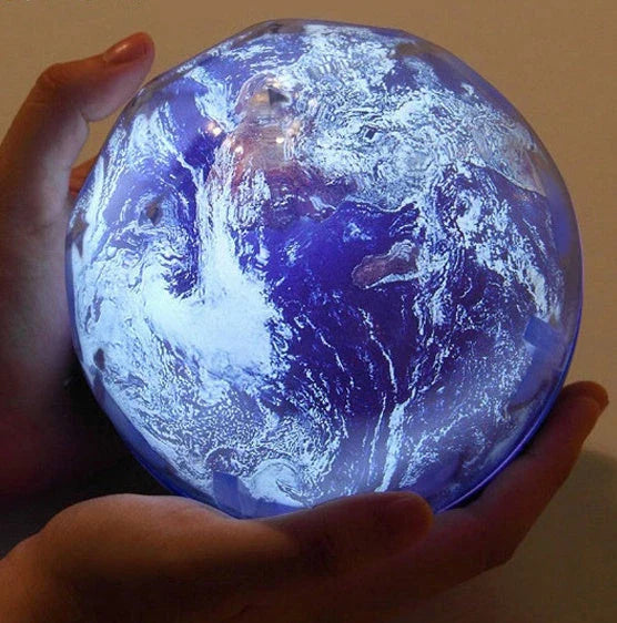 Galaxy Projection Lamp casting mesmerizing celestial imagery in a cozy home setting