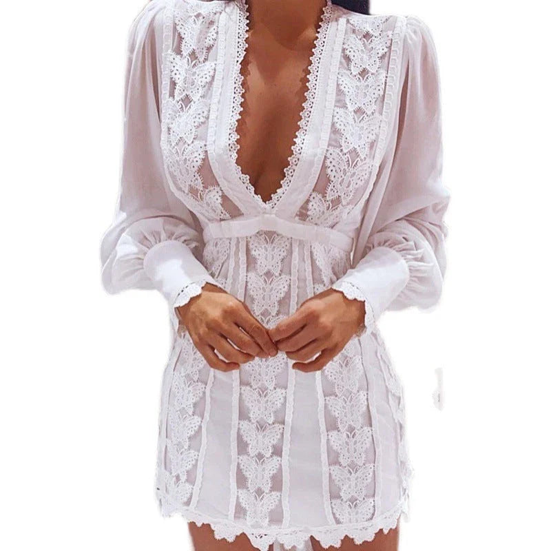 Elegant white lace dress with puff sleeves and butterfly design, perfect for formal occasions and events