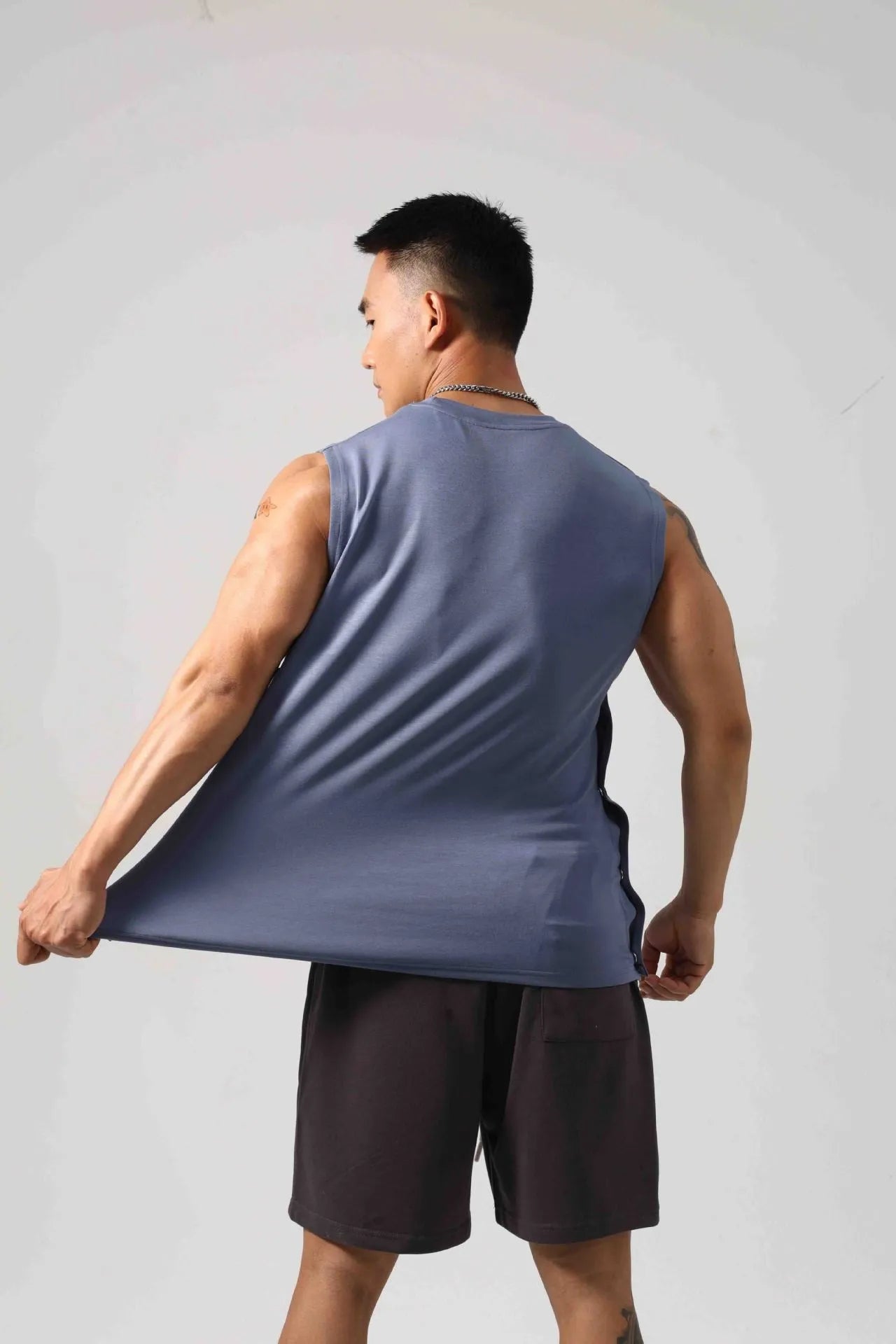 Korean style men's loose fitness vest with hidden hook design in solid colour