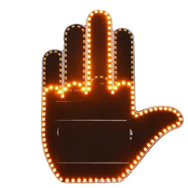 Black plastic LED gesture car light showing illuminated hand symbol, with remote control.