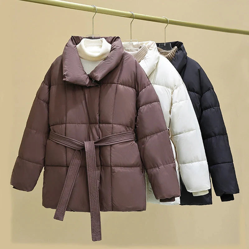 Stylish plaid belted winter coat for women in black, white, and brown