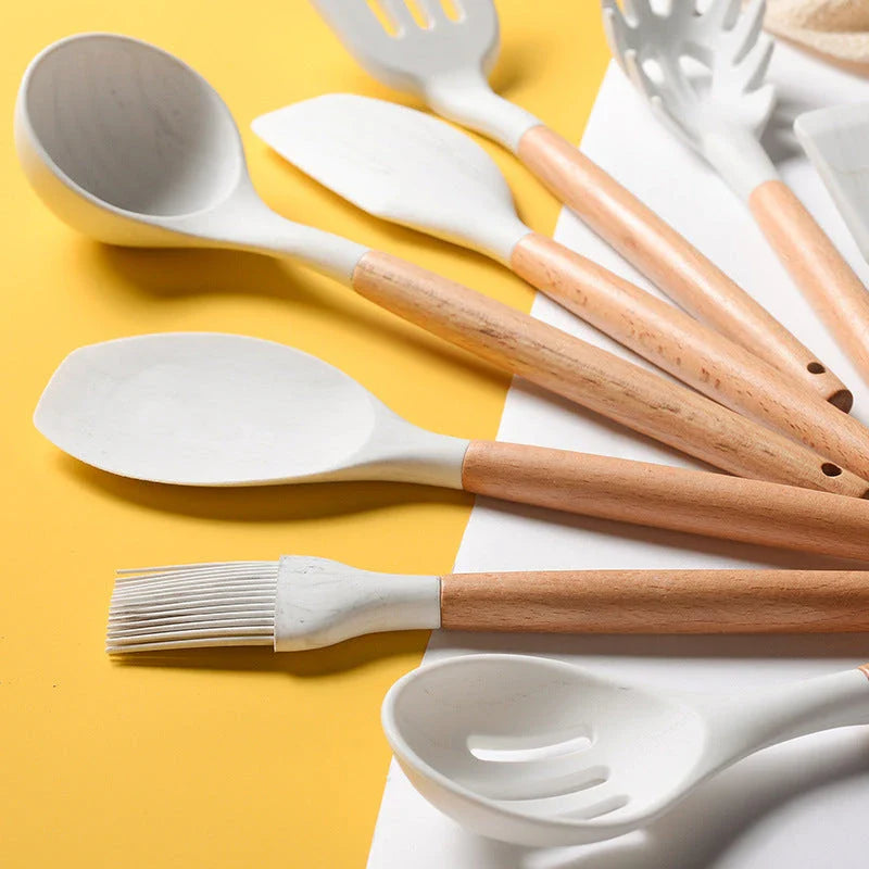 Premium silicone cooking tool set with elegant marbled wooden handles, designed for high-temperature cooking and baking tasks
