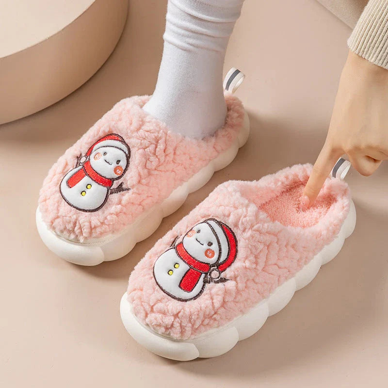 Cozy snowman-themed slippers with plush interior and thick, anti-slip soles for warm, comfortable indoor wear