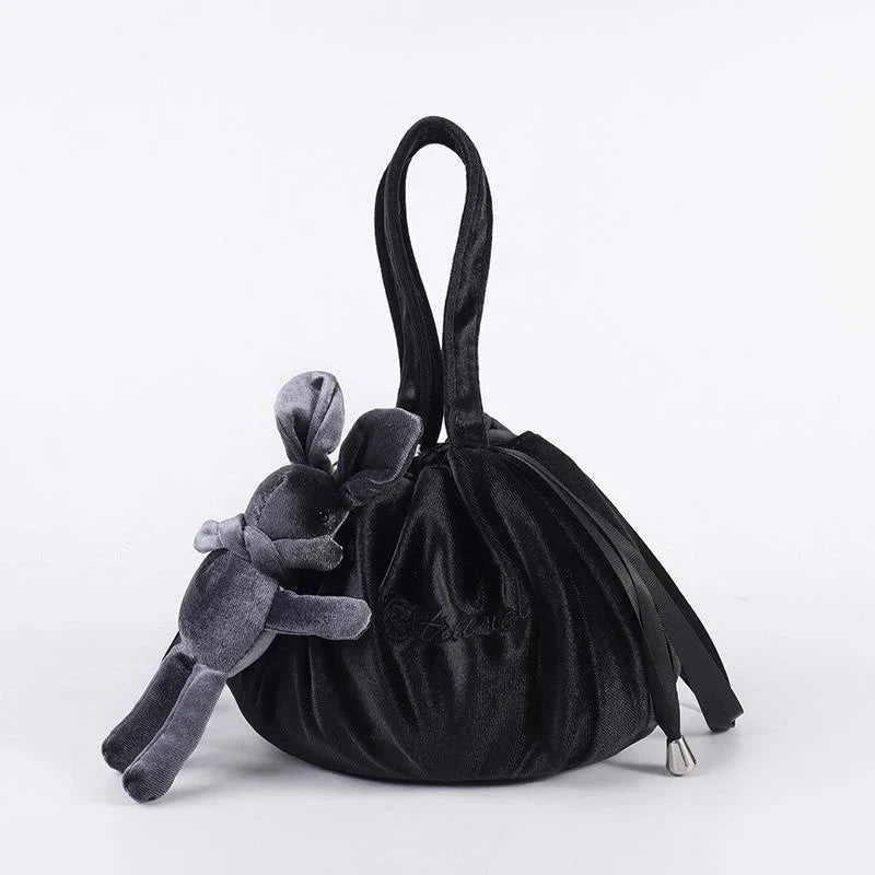 Adorable rabbit ear velvet cosmetic bags in various colors for storing and organizing makeup, toiletries, and other beauty essentials.