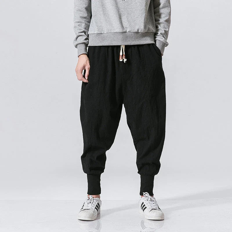 Men's harem trousers made of soft cotton and linen, featuring an elastic waistband and relaxed silhouette for all-day comfort.
