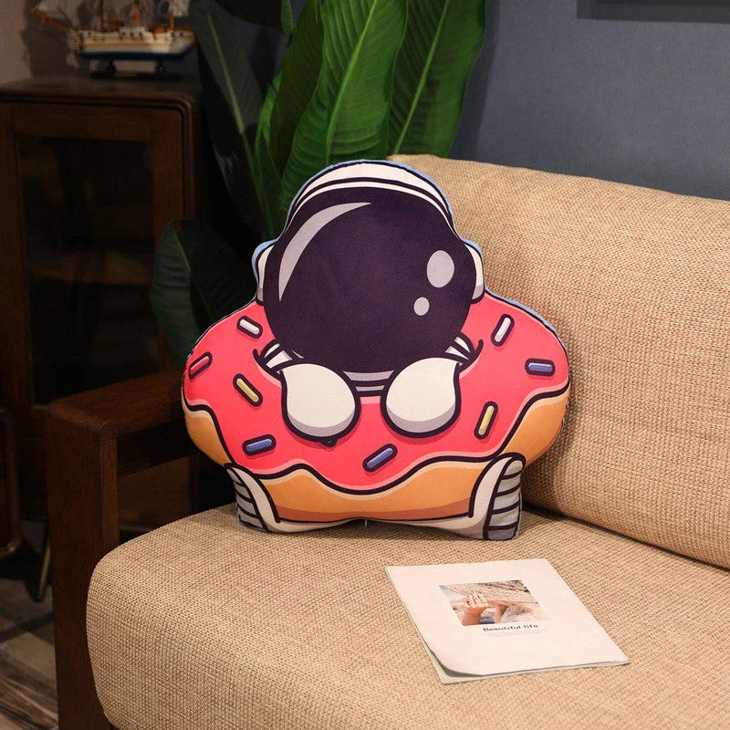Soft plush astronaut pillows in various space-themed designs, including rockets, spacecraft, and more