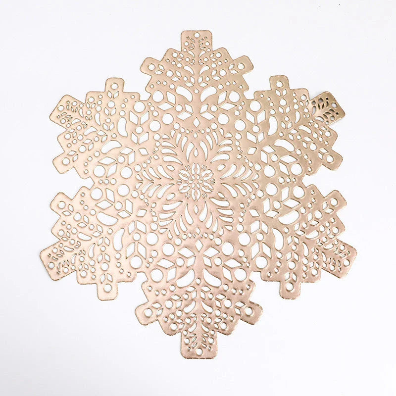 Snowflake-patterned heat-resistant placemats in gold and silver colors, ideal for holiday table settings and decor