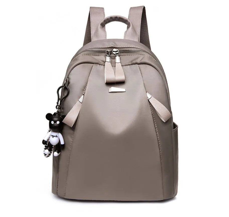 Medium square rucksack in Oxford cloth with internal organisation pockets.
