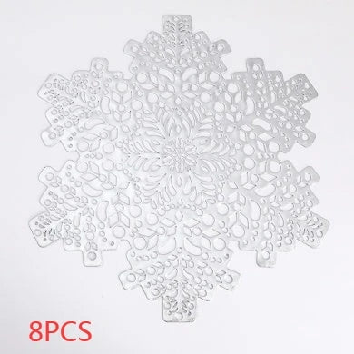 Snowflake-patterned heat-resistant placemats in gold and silver colors, ideal for holiday table settings and decor