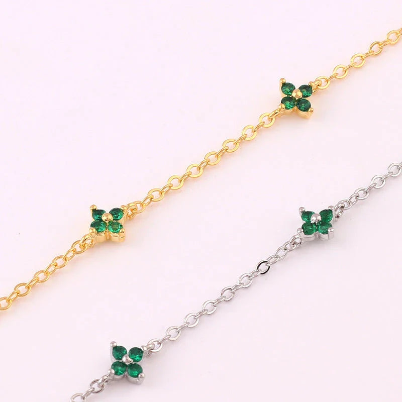 Elegant gold and silver floral necklace with adjustable chain and flower charm, perfect for vacation and beach outfits