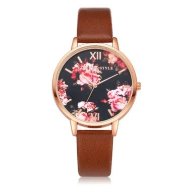 Elegant rose gold women's watch with leather strap and love heart design