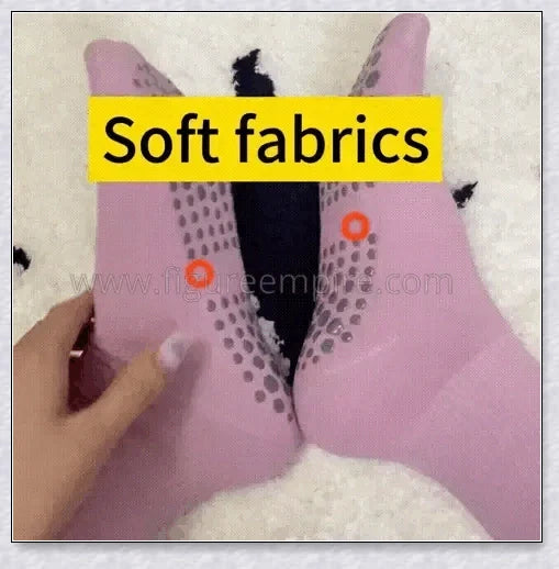 Pair of self-heating massage socks with detailed view of the acupressure-inspired soles