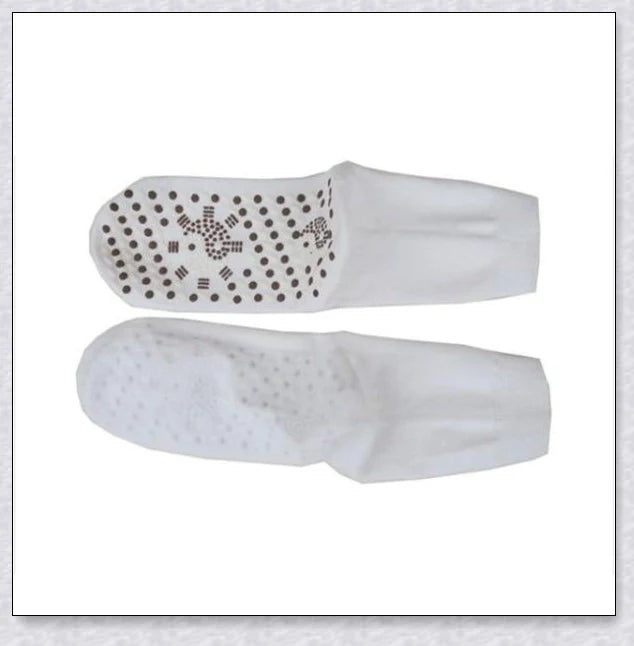 Pair of self-heating massage socks with detailed view of the acupressure-inspired soles