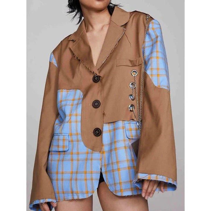 A chic women's winter blazer with a checkered pattern and chain accent, perfect for the modern British fashion enthusiast.