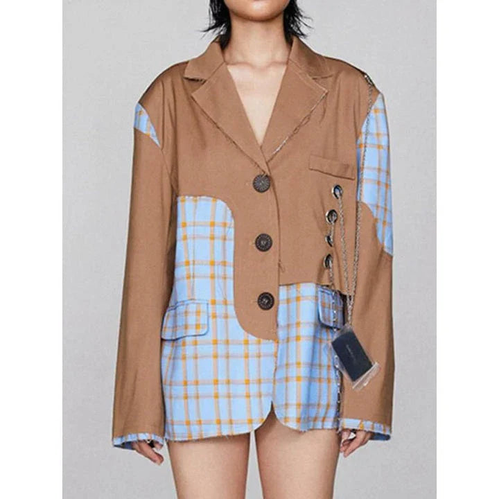 A chic women's winter blazer with a checkered pattern and chain accent, perfect for the modern British fashion enthusiast.