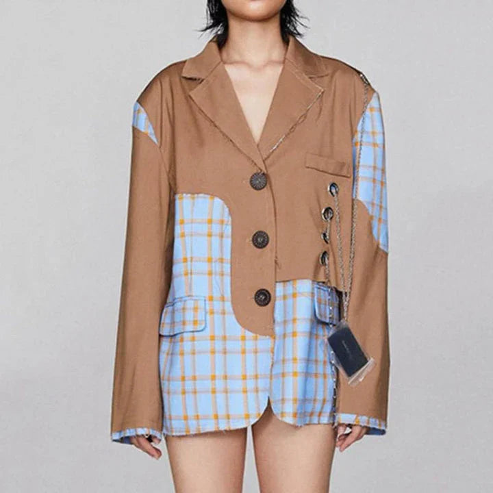 A chic women's winter blazer with a checkered pattern and chain accent, perfect for the modern British fashion enthusiast.