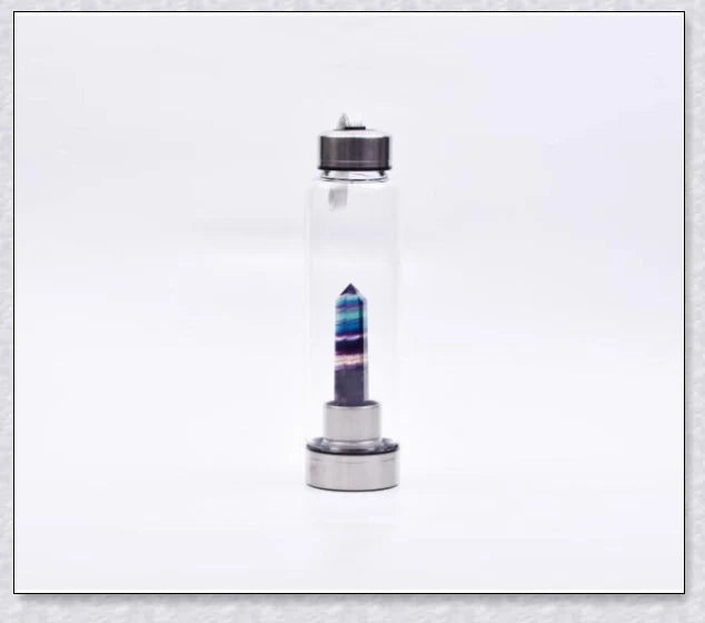 A handcrafted glass water bottle infused with natural crystals, offering a unique and sustainable hydration experience.