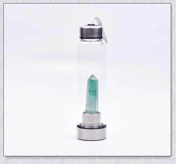 A handcrafted glass water bottle infused with natural crystals, offering a unique and sustainable hydration experience.