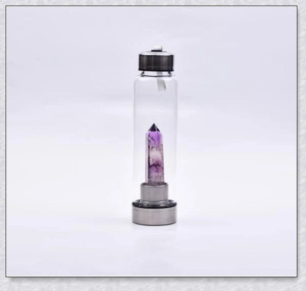 A handcrafted glass water bottle infused with natural crystals, offering a unique and sustainable hydration experience.