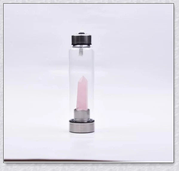 A handcrafted glass water bottle infused with natural crystals, offering a unique and sustainable hydration experience.