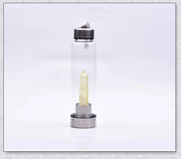 A handcrafted glass water bottle infused with natural crystals, offering a unique and sustainable hydration experience.