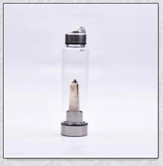 A handcrafted glass water bottle infused with natural crystals, offering a unique and sustainable hydration experience.