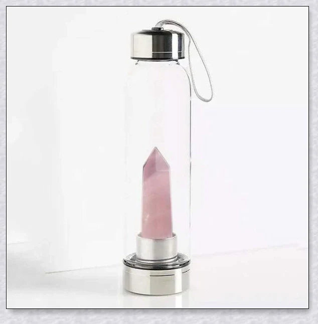 A handcrafted glass water bottle infused with natural crystals, offering a unique and sustainable hydration experience.