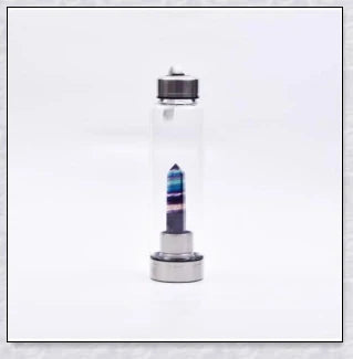 A handcrafted glass water bottle infused with natural crystals, offering a unique and sustainable hydration experience.