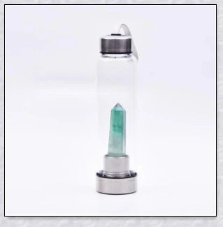 A handcrafted glass water bottle infused with natural crystals, offering a unique and sustainable hydration experience.