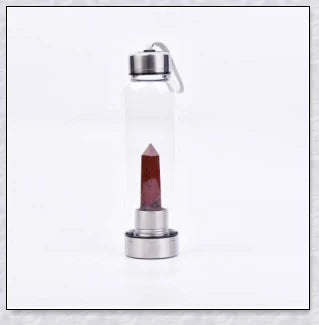 A handcrafted glass water bottle infused with natural crystals, offering a unique and sustainable hydration experience.