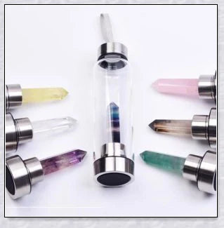 A handcrafted glass water bottle infused with natural crystals, offering a unique and sustainable hydration experience.