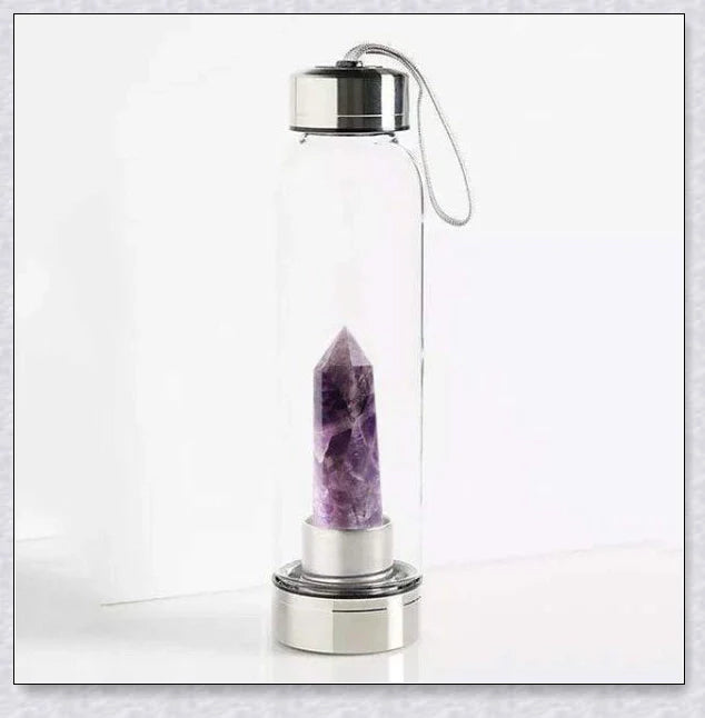A handcrafted glass water bottle infused with natural crystals, offering a unique and sustainable hydration experience.