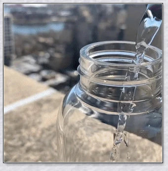A handcrafted glass water bottle infused with natural crystals, offering a unique and sustainable hydration experience.