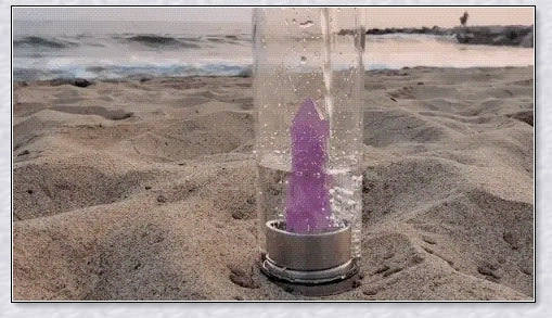 A handcrafted glass water bottle infused with natural crystals, offering a unique and sustainable hydration experience.