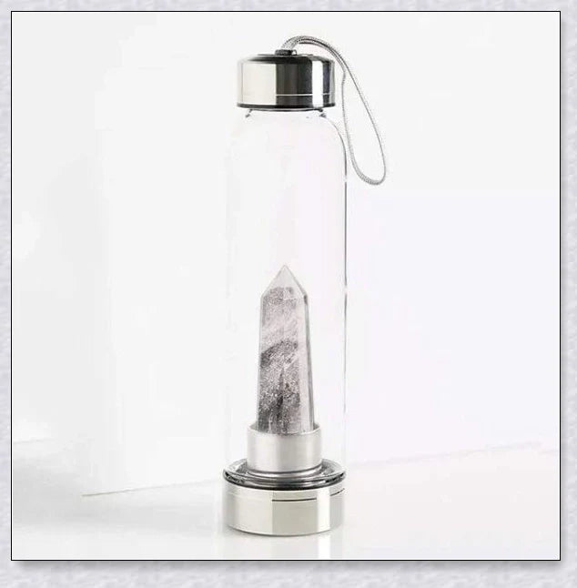 A handcrafted glass water bottle infused with natural crystals, offering a unique and sustainable hydration experience.