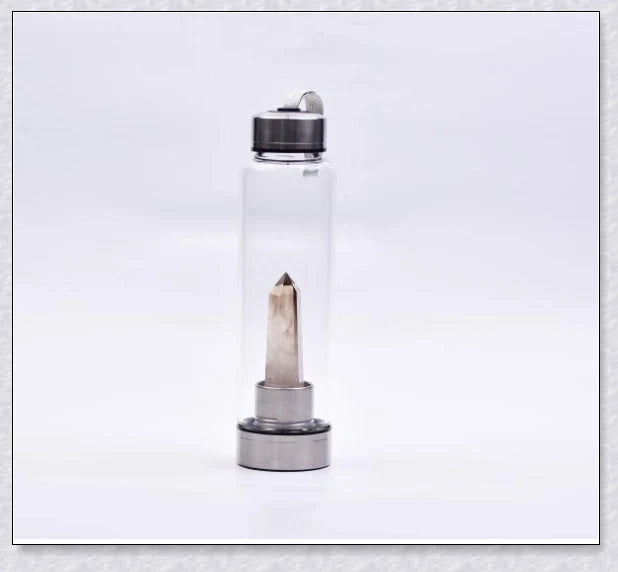 A handcrafted glass water bottle infused with natural crystals, offering a unique and sustainable hydration experience.
