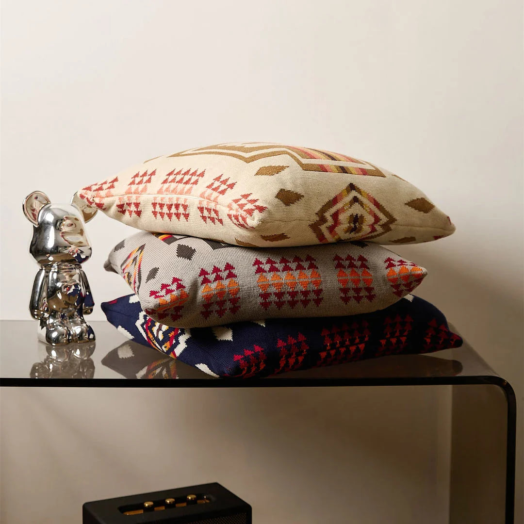 Geometric-patterned cushion cover made of soft, breathable 100% cotton