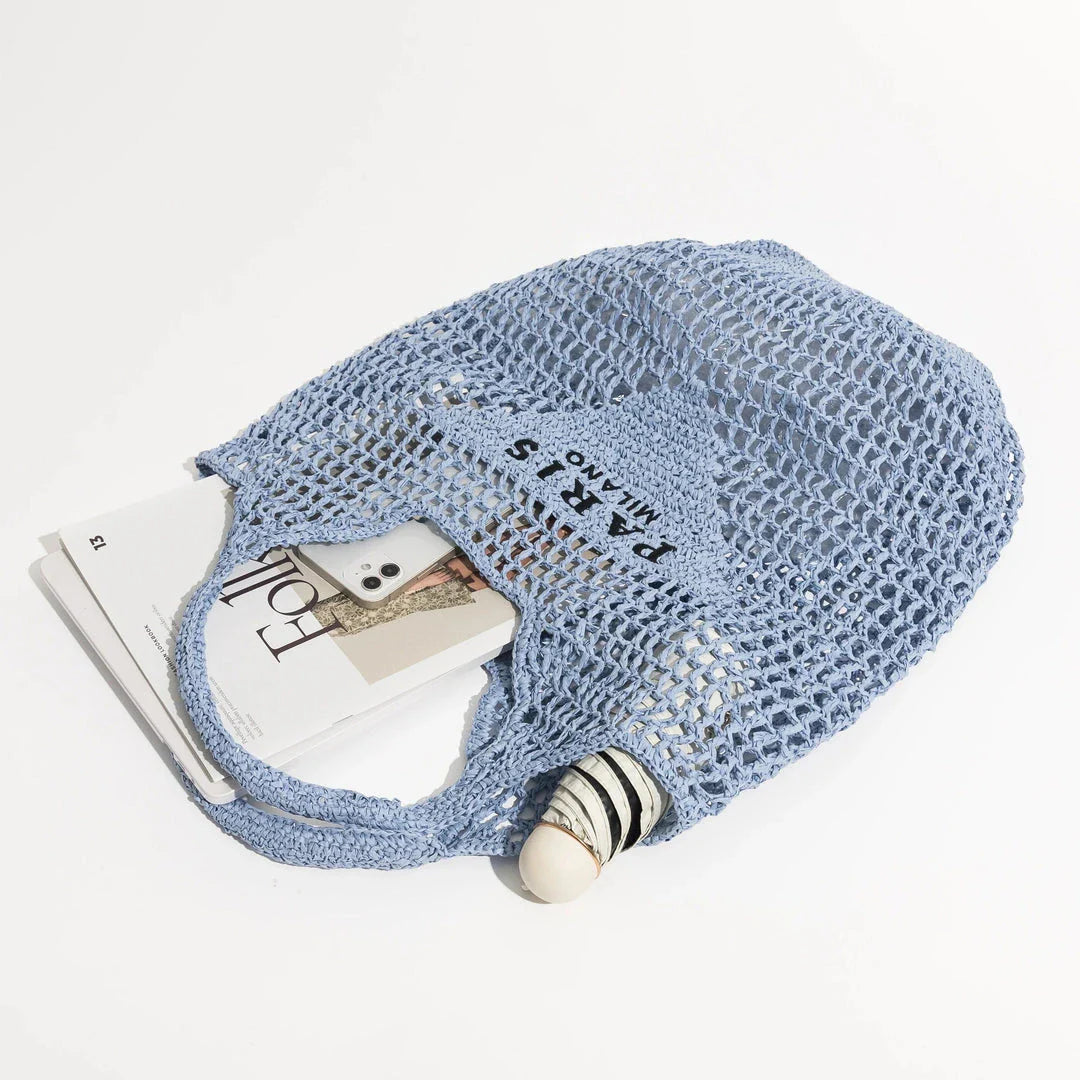 Luxury design women's plaited raffia straw bag in blue color, featuring a criss-cross pattern and large capacity for everyday use.