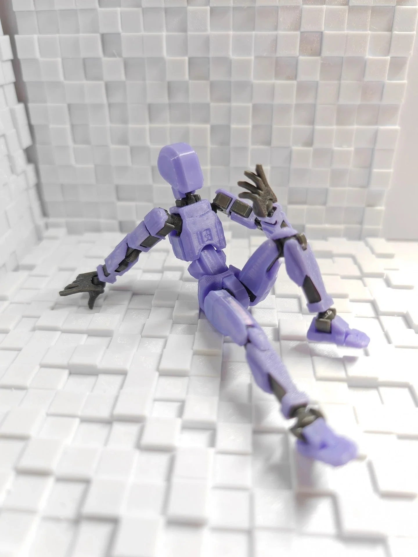 Customizable 3D printed multi-jointed action figure robot toy in various vibrant colors