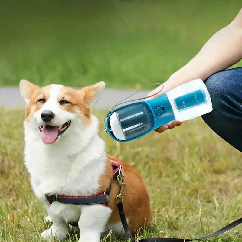 Portable 3-in-1 pet water bottle with built-in filtration system, food container, and waste bag storage compartment