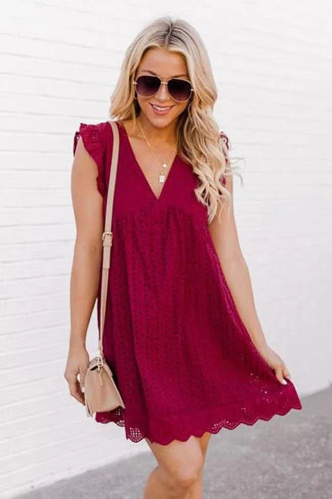 Stylish summer beach dress with lace accents, pockets, and a variety of vibrant color options