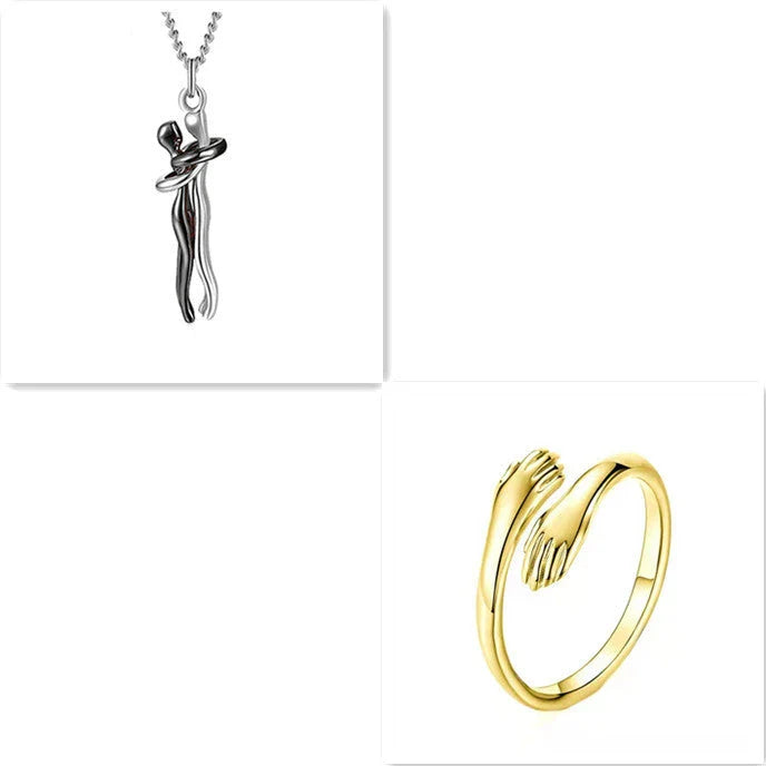 Stylish embracing pendant necklace in various colors, including rose gold, white black, black gold, and more. Minimalist design with a delicate chain.