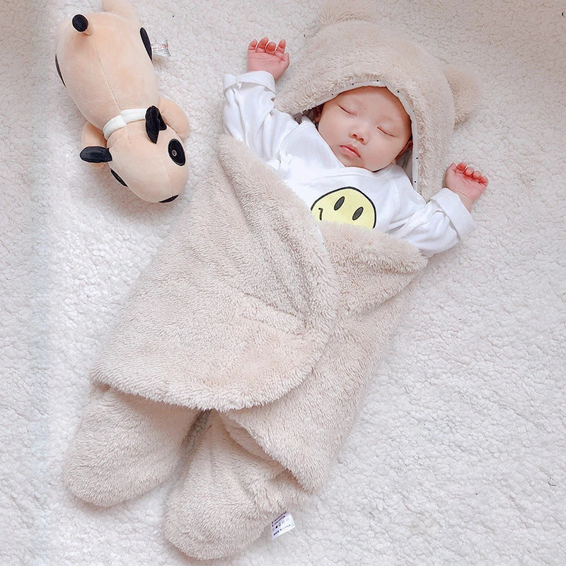 Cozy cotton baby sleeping bag with soft, breathable interior and warm, insulating outer layer