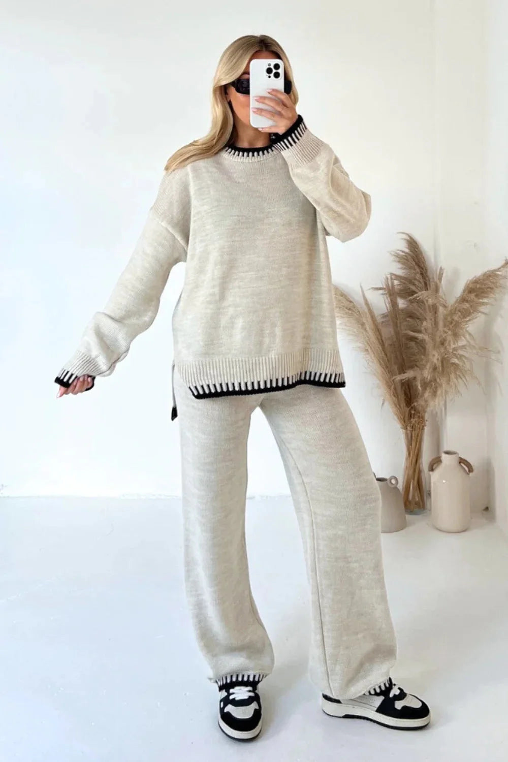 Stylish women's two-piece suit set with long-sleeved top and loose pants in various colours