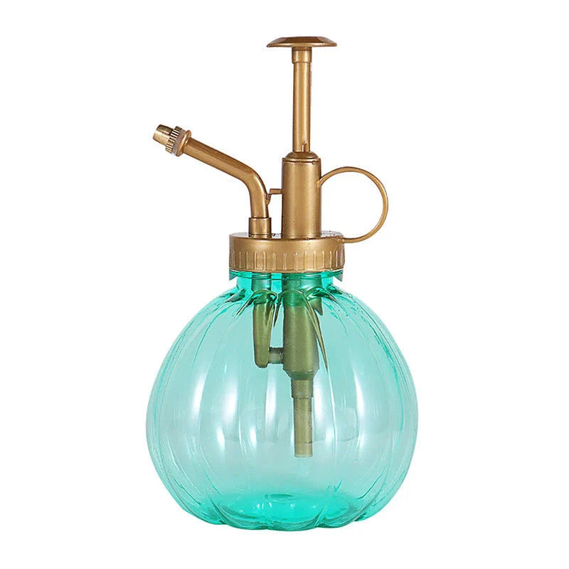 A stylish garden sprayer in a pumpkin shape with a retro-inspired copper pressure bar, designed for watering flowers and plants efficiently.
